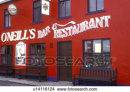 Picture -  Europe, Republic of Ireland, Ireland, West Coast, Beara Peninsula, The bright red building of O'Neills Bar & Restaurant in the town of Allihies on the Beara Peninsula in County Cork.. Fotosearch