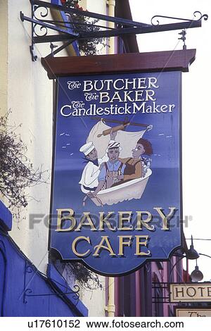 Stock Image -  Europe, Republic of Ireland, Ireland, Ring of Kerry, Kenmare, The Butcher, the Baker, the Candlestick Maker sign appears over a store front in Kenmare in County Kerry.. Fotosearch