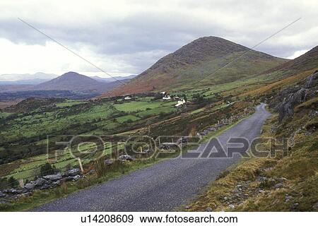 Stock Photo -  Europe, Republic of Ireland, Ireland, Beara Peninsula, A narrow road winds through the scenic countryside over the Healy Pass in County Kerry.. Fotosearch