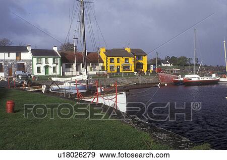 Stock Photo -  Europe, Republic of Ireland, Ireland, Boats docked in Kinvarra Bay in the colorful quaint town of Kinvarra in County Galway.. Fotosearch