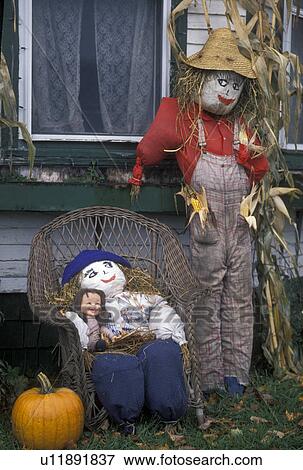 fall decoration, Vermont, A display of two scarecrows, one sitting one standing, decorate the front of a house in South Walden in the fall in Caledonia County in the state of Vermont. View Large Photo Image Stock Photo - fall decoration, Vermont, A display of two scarecrows, one sitting one standing, decorate the front of a house in South Walden in the fall in Caledonia County in the state of Vermont.. Fotosearch