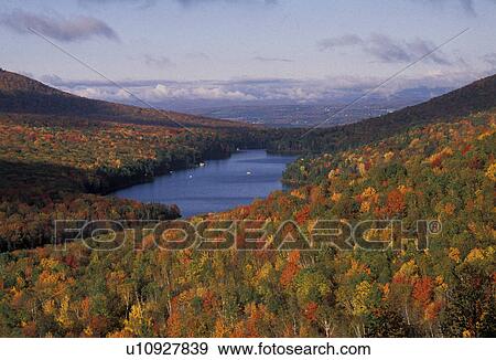 Stock Photo -  fall, foliage, lake, Vermont, Groton State Forest, Scenic view of Kettle Pond and colorful fall foliage from Owl's Head Overlook in Groton State Forest. . Fotosearch