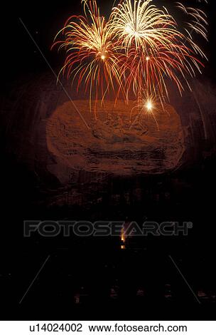 Stock Image -  Fireworks, Stone Mountain, Georgia's Stone Mountain Park, Atlanta, Georgia, A Firework display at the Laser Show on Stone Mountain in Georgia's Stone Mt. Park near Atlanta in the state of Georgia.. Fotosearch
