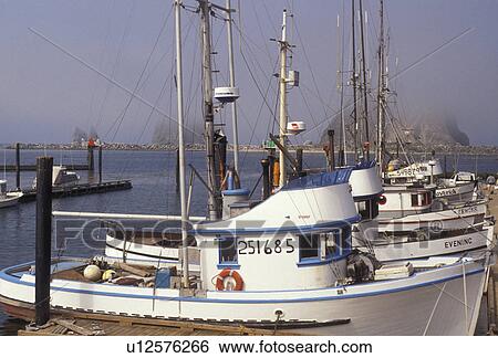 Stock Photograph -  fishing boats, Quileute Indian Reservation, Washington, Olympic Peninsula, Fishing boats docked at the marina at the Quileute Indian Reservation in Queets in the state of Washington. . Fotosearch