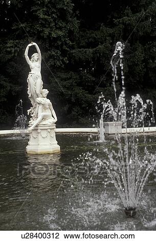 Stock Image -  fountain, Saratoga Springs, New York, Sculpture in a fountain in the gardens at Yaddo in Saratoga Springs in the state of New York. . Fotosearch