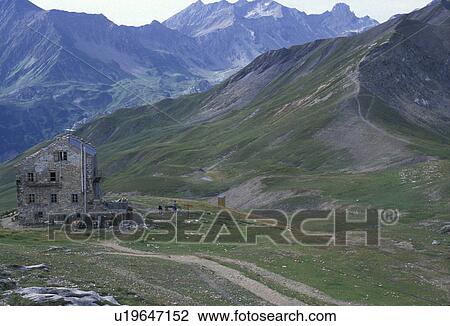 France, Alps, mountains, trail, hiking, Europe, Alpine stone house (hut) at Col de la Croix du Bonhomme, a resting place for hikers in the mountains along the GR5 trail and Tour du Mont Blanc trail in Savoie. View Large Photo Image Stock Image - France, Alps, mountains, trail, hiking, Europe, Alpine stone house (hut) at Col de la Croix du Bonhomme, a resting place for hikers in the mountains along the GR5 trail and Tour du Mont Blanc trail in Savoie.. Fotosearch