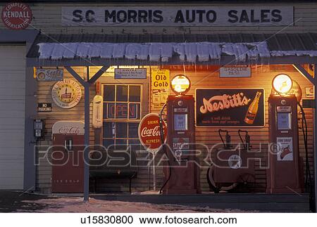 gas station, Vermont, VT, Antique gas pumps in front of a gas station illuminated at night in the village of Orange in the snow in winter. View Large Photo Image Stock Image - gas station, Vermont, VT, Antique gas pumps in front of a gas station illuminated at night in the village of Orange in the snow in winter. . Fotosearch