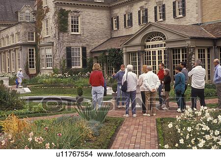 Picture -  George Eastman, Rochester, Eastman Kodak, New York, photography, Visitors in The East Terrace Garden at The George Eastman House in Rochester in the state of New York.. Fotosearch