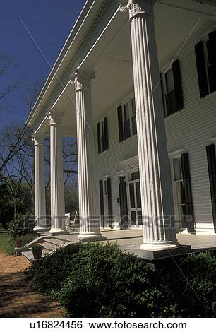 Stock Photograph -  Georgia, Madison, The 1890 Trammel House in the Historic District of Madison. White house with black shutters . Fotosearch