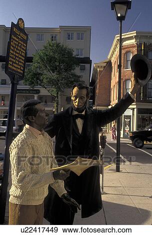 Stock Photo -  Gettysburg, Abraham Lincoln, Pennsylvania, Statue of Abraham Lincoln talking to a man outside the Lincoln Room Museum in Gettysburg in the state of Pennsylvania.. Fotosearch