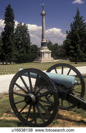 Stock Photo -  Gettysburg, battlefield, cannon, battle, cemetery, Pennsylvania, Cannon near the New York State Monument in Gettysburg National Cemetery at Gettysburg National Military Park in Gettysburg in the state of Pennsylvania.. Fotosearch