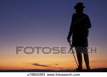 Stock Image -  Gettysburg, battlefield, civil war, Gettysburg National Military Park, Pennsylvania, Silhouette of Gouvernor K. Warren statue on Little Round Top at sunset in Gettysburg Nat'l Military Park in Gettysburg in the state of Pennsylvania.. Fotosearch