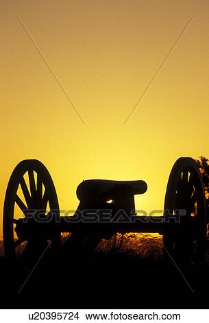 Picture -  Gettysburg, cannon, battlefield, battle, Gettysburg Military Park, Pennsylvania, Silhouette of cannon at sunset on East Cemetery Hill a battlefield site at Gettysburg National Military Park in Gettysburg in the state of Pennsylvania.. Fotosearch