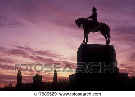 Gettysburg, civil war, battlefield, Gettysburg National Military Park, Pennsylvania, Silhouette of soldier and cavalier monument at East Cemetery Hill in Gettysburg Nat'l Military Park at sunset in Gettysburg in the state of Pennsylvania. View Large Photo Image Stock Photo - Gettysburg, civil war, battlefield, Gettysburg National Military Park, Pennsylvania, Silhouette of soldier and cavalier monument at East Cemetery Hill in Gettysburg Nat'l Military Park at sunset in Gettysburg in the state of Pennsylvania.. Fotosearch