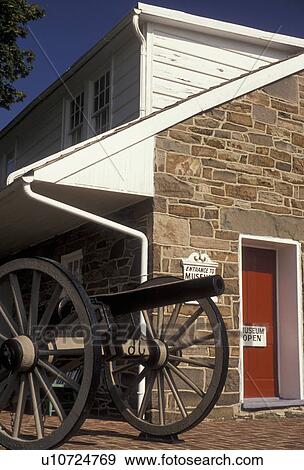 Stock Photo -  Gettysburg, civil war, museum, Pennsylvania, A cannon is displayed outside General Lee's Headquarters Museum a stone house that dates from the early 1800's in Gettysburg in the state of Pennsylvania. . Fotosearch