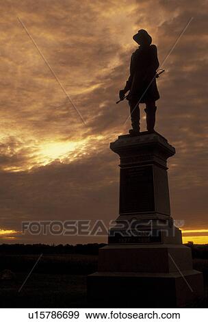 Stock Photo -  Gettysburg, Gettysburg National Military Park, civil war, battlefield, Pennsylvania, Silhouette of soldier monument in Gettysburg Nat'l Military Park at sunset in Gettysburg in the state of Pennsylvania.. Fotosearch