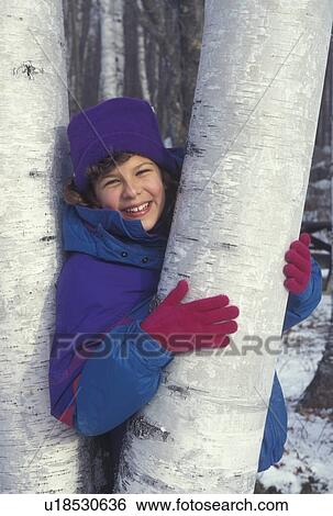 girl, Vermont, Birch tree, Girl (10 years old) smiles while posing for picture holding onto the white trunk of a birch tree in Groton State Forest in Caledonia County in the state of Vermont. View Large Photo Image Stock Photograph - girl, Vermont, Birch tree, Girl (10 years old) smiles while posing for picture holding onto the white trunk of a birch tree in Groton State Forest in Caledonia County in the state of Vermont.. Fotosearch