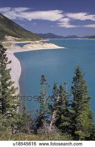 Stock Photograph -  glacier lake, Alberta, Canada, Canadian Rockies, Rocky Mountains, Scenic view of the turquoise colored Abraham Lake in Rocky Mountains National Forest in the province of Alberta. . Fotosearch