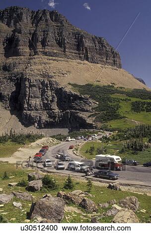 Glacier National Park, Montana, Rocky Mountains, road, Waterton-Glacier International Peace Park, Cars line the winding Going-to-the-Sun road through Glacier National Park in the state of Montana. View Large Photo Image Stock Image - Glacier National Park, Montana, Rocky Mountains, road, Waterton-Glacier International Peace Park, Cars line the winding Going-to-the-Sun road through Glacier National Park in the state of Montana.. Fotosearch