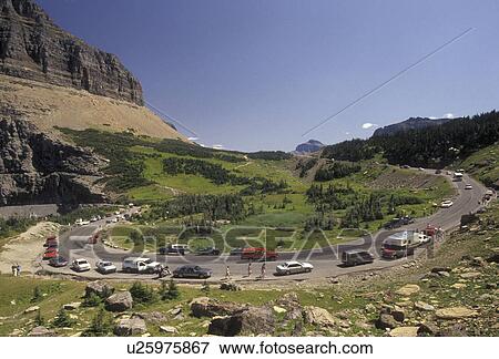 Glacier National Park, Montana, Rocky Mountains, road, Waterton-Glacier International Peace Park, Cars line the winding Going-to-the-Sun road through Glacier National Park in the state of Montana. View Large Photo Image Stock Photo - Glacier National Park, Montana, Rocky Mountains, road, Waterton-Glacier International Peace Park, Cars line the winding Going-to-the-Sun road through Glacier National Park in the state of Montana.. Fotosearch