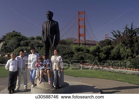 Golden Gate, San Francisco, The Golden Gate Bridge, California, San Francisco Bay, A family poses for a picture in front of the statue of Joseph B. Strauss at The Golden Gate Bridge of San Francisco in the state of California. View Large Photo Image Stock Photograph - Golden Gate, San Francisco, The Golden Gate Bridge, California, San Francisco Bay, A family poses for a picture in front of the statue of Joseph B. Strauss at The Golden Gate Bridge of San Francisco in the state of California. . Fotosearch