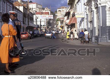 Stock Photo -  Grenada, Caribbean, St. George's, Caribbean Islands, Local people walking on the street in downtown St. George's the capital city of the island of Grenada the spice isle (a British Commonwealth member).. Fotosearch