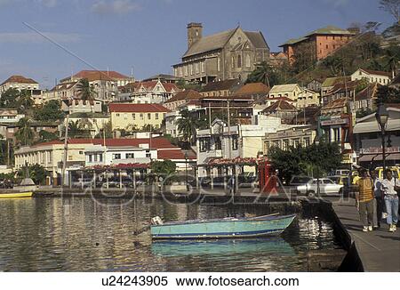 Grenada, Caribbean, St. George's, Caribbean Islands, People walking along the Carenage of the inner harbor with a scenic view of St. George's the capital city on the steep hillside on the island of Grenada the spice isle (a British Commonwealth member). View Large Photo Image Stock Photography - Grenada, Caribbean, St. George's, Caribbean Islands, People walking along the Carenage of the inner harbor with a scenic view of St. George's the capital city on the steep hillside on the island of Grenada the spice isle (a British Commonwealth member).. Fotosearch