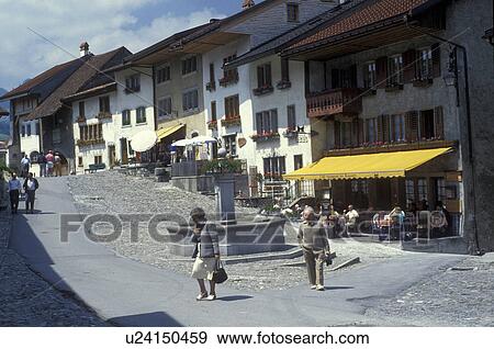 Gruyeres, Fribourg, Switzerland, Europe, People walking down the cobbled main street of the fortified medieval town of Gruyeres in the canton of Fribourg home of Gruyeres cheese. View Large Photo Image Stock Photo - Gruyeres, Fribourg, Switzerland, Europe, People walking down the cobbled main street of the fortified medieval town of Gruyeres in the canton of Fribourg home of Gruyeres cheese.. Fotosearch