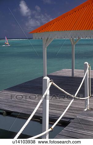 Guadeloupe, Caribbean, Caribbean Islands, resort, Scenic view of windsurfing on the blue-green water of the Caribbean Sea from the red roof pier at Hotel Meridien in St. Francois on the island of Grande-Terre in Guadeloupe (a french department) The Emera View Large Photo Image Stock Photo - Guadeloupe, Caribbean, Caribbean Islands, resort, Scenic view of windsurfing on the blue-green water of the Caribbean Sea from the red roof pier at Hotel Meridien in St. Francois on the island of Grande-Terre in Guadeloupe (a french department) The Emera. Fotosearch