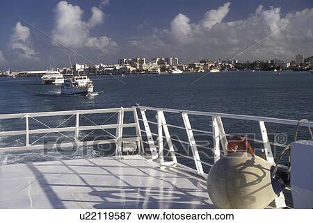 Guadeloupe, Caribbean, Caribbean Islands, Looking across the harbor at Pointe-a-Pitre from the deck of a boat on the island of Grande-Terre in Guadeloupe (a french department) The Emerald Isle. View Large Photo Image Stock Photo - Guadeloupe, Caribbean, Caribbean Islands, Looking across the harbor at Pointe-a-Pitre from the deck of a boat on the island of Grande-Terre in Guadeloupe (a french department) The Emerald Isle.. Fotosearch