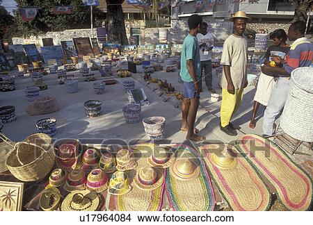 Picture -  Haiti, art market, Caribbean, Haitian street artists display their crafts on the street in the city of Petionville in Haiti.. Fotosearch