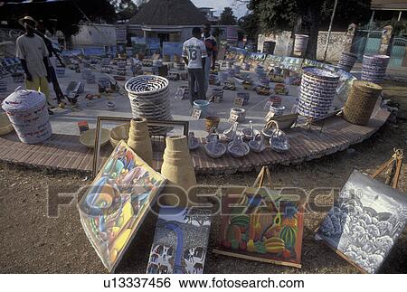 Stock Photograph -  Haiti, art market, Caribbean, Haitian street artists display their crafts on the street in the city of Petionville in Haiti.. Fotosearch