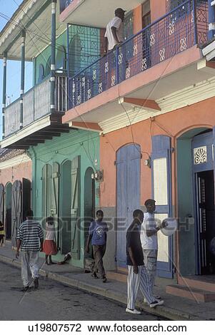 Stock Image -  Haiti, Caribbean, Pastel painted walls on colonial houses in the city of Cap-Haitian in Haiti . Fotosearch