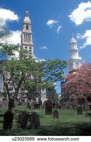 Stock Photo -  Hartford, Connecticut, The Travelers Insurance Tower Building, the 1807 Center Church and the Ancient Burying Ground in the capital city of Hartford, Connecticut in the spring. . Fotosearch