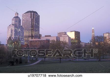 Stock Photo -  Hartford, skyline, Bushnell Park, Connecticut, The downtown skyline of Hartford the capital city of Connecticut from Bushnell Park in the evening.. Fotosearch