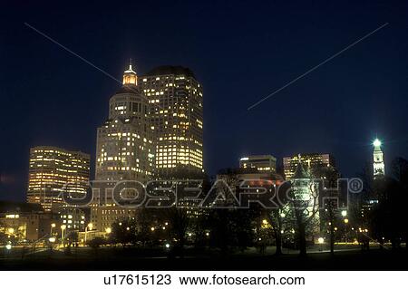Stock Image -  Hartford, skyline, Connecticut, The downtown skyline of Hartford the capital city of Connecticut from Bushnell Park at night.. Fotosearch