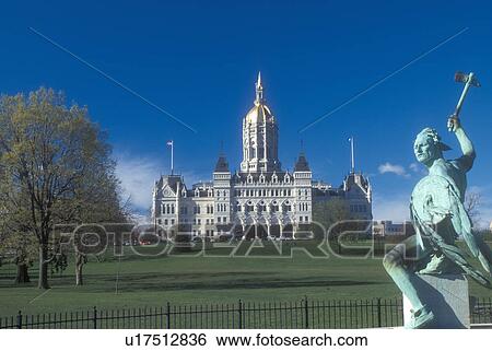 Stock Photograph -  Hartford, State Capitol, State House, Connecticut, The State Capitol of Hartford, Connecticut from the Corning Fountain Bushnell Park. Indian sculpture.. Fotosearch