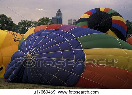 hot air balloon, Atlanta, Georgia, Inflating balloons for a hot air balloon race at the Dogwood Festival in Piedmont Park in Atlanta. Midtown skyline in the background. View Large Photo Image Stock Photo - hot air balloon, Atlanta, Georgia, Inflating balloons for a hot air balloon race at the Dogwood Festival in Piedmont Park in Atlanta. Midtown skyline in the background.. Fotosearch