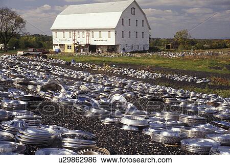 hubcap, Pennsylvania, An abundance of hub caps for sale on the lawn in front of a barn in Abbottstown in the state of Pennsylvania View Large Photo Image Stock Photograph - hubcap, Pennsylvania, An abundance of hub caps for sale on the lawn in front of a barn in Abbottstown in the state of Pennsylvania . Fotosearch