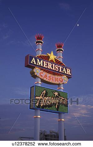 Stock Image -  Iowa, Council Bluffs, casino, Ameristar Casino Hotel sign lit up at night in Council Bluffs. Fotosearch