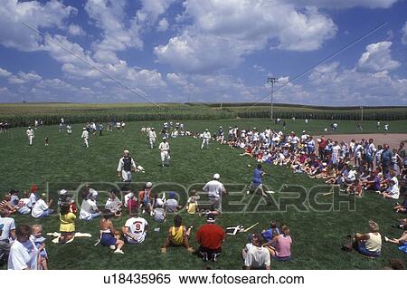 Iowa, Dyersville, Field of Dreams Movie Site in Dyersville. Crowd of people watch The Ghost Team play an exhibition baseball game with children View Large Photo Image Stock Photography - Iowa, Dyersville, Field of Dreams Movie Site in Dyersville. Crowd of people watch The Ghost Team play an exhibition baseball game with children . Fotosearch