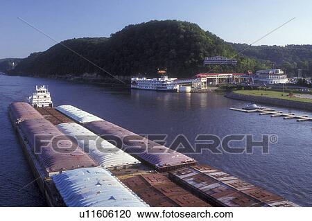 Iowa, Marquette, A barge carrying cargo floats down the Mississippi River in Marquette next to the Marquette Riverboat Casino and marina View Large Photo Image Stock Image - Iowa, Marquette, A barge carrying cargo floats down the Mississippi River in Marquette next to the Marquette Riverboat Casino and marina . Fotosearch