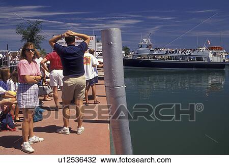 Lake Huron, ferry, Mackinaw City, Mackinac Island, Michigan, People waiting on the dock for Shepler's passenger ferry to take them to Mackinac Island in the state of Michigan. View Large Photo Image Stock Image - Lake Huron, ferry, Mackinaw City, Mackinac Island, Michigan, People waiting on the dock for Shepler's passenger ferry to take them to Mackinac Island in the state of Michigan.. Fotosearch