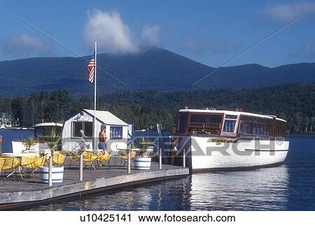 Lake Placid, Adirondacks, Adirondack Park, New York, Scenic view of Lake Placid. Cruise boat is docked waiting for passengers in the state of New York. View Large Photo Image Stock Image - Lake Placid, Adirondacks, Adirondack Park, New York, Scenic view of Lake Placid. Cruise boat is docked waiting for passengers in the state of New York.. Fotosearch