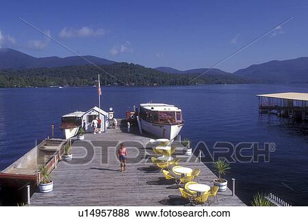 Lake Placid, Adirondacks, Adirondack Park, New York, Scenic view of Lake Placid. Cruise boat is docked waiting for passengers in the state of New York. View Large Photo Image Stock Photo - Lake Placid, Adirondacks, Adirondack Park, New York, Scenic view of Lake Placid. Cruise boat is docked waiting for passengers in the state of New York.. Fotosearch