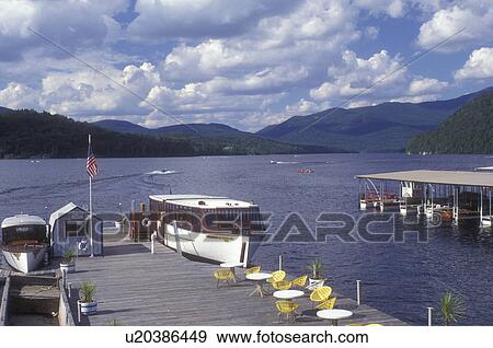 Lake Placid, Adirondacks, Adirondack Park, New York, Scenic view of Lake Placid. Cruise boat is docked waiting for passengers in the state of New York. View Large Photo Image Stock Photo - Lake Placid, Adirondacks, Adirondack Park, New York, Scenic view of Lake Placid. Cruise boat is docked waiting for passengers in the state of New York.. Fotosearch