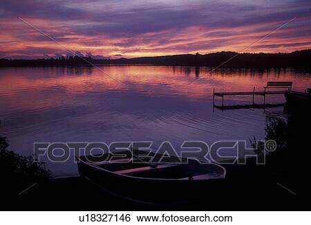 lake, sunrise, sunset, Upper Peninsula, U. P Michigan, Rowboat on the beach at sunset over the calm waters of Ruth Lake in Three Lakes in the state of Michigan. View Large Photo Image Stock Photograph - lake, sunrise, sunset, Upper Peninsula, U. P Michigan, Rowboat on the beach at sunset over the calm waters of Ruth Lake in Three Lakes in the state of Michigan.. Fotosearch