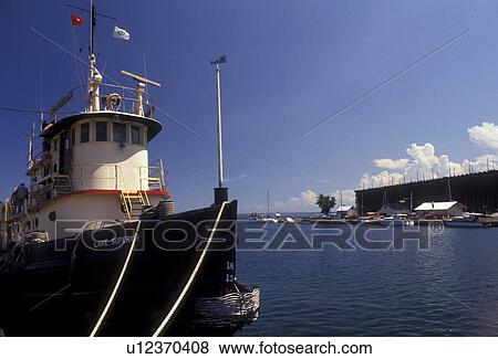 Stock Photo -  Lake Superior, tug boat, Upper Peninsula, U. P Michigan, Boat moored at Old Ore Dock and Marina at Lower Harbor on Lake Superior in Marquette in the state of Michigan.. Fotosearch