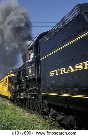 Stock Photo -  Lancaster County, engine, Pennsylvania, locomotive, excursion train, Strasburg Rail Road Company, train, Steam locomotive pulls the passenger train through the Amish Country in Strasburg in Pennsylvania Dutch Country in the state of Pennsylvania. . Fotosearch