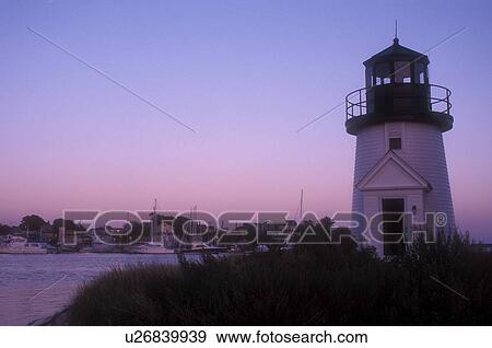 Stock Photo -  lighthouse, Cape Cod, Massachusetts, Lewis Bay Lighthouse at Inner Harbor in Hyannis along the Atlantic Coast, Massachusetts at [sunset, sunrise]. . Fotosearch